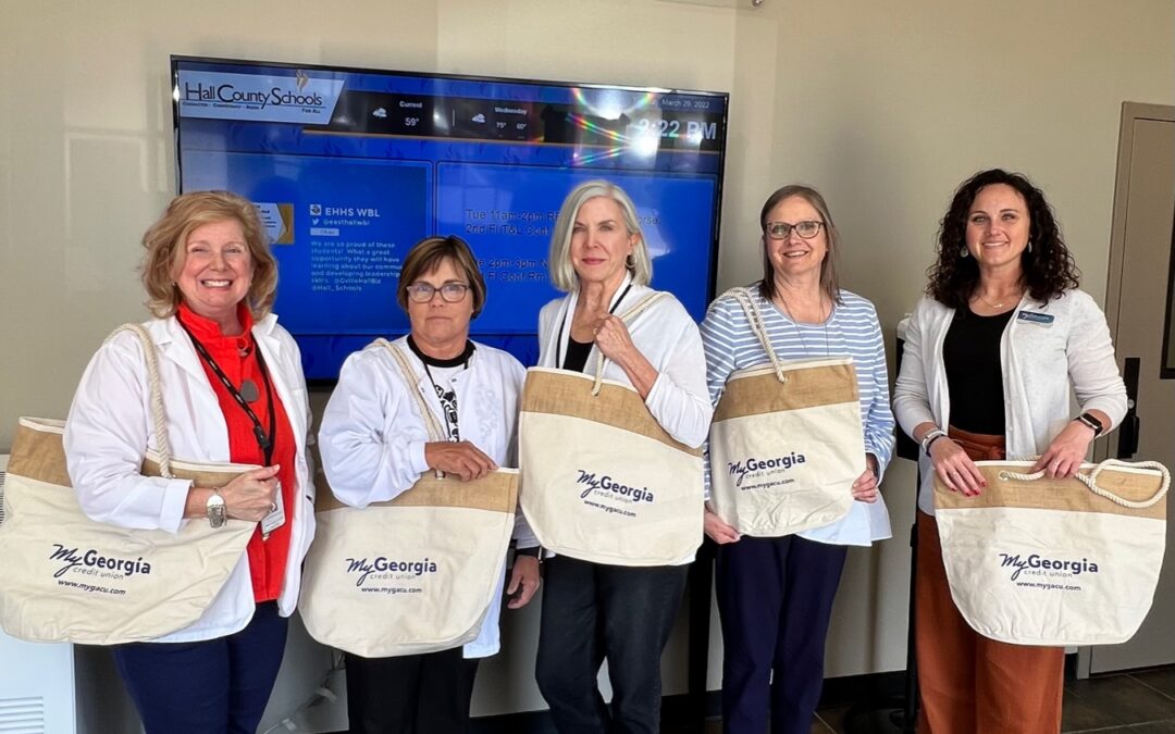 Nurses holding bag